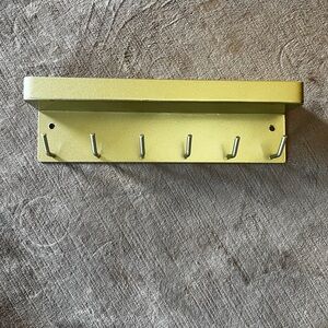 Gold tone modern key holder and shelf. Like new.